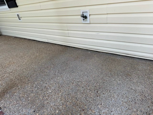 White efflorescence deposits showing past standing water