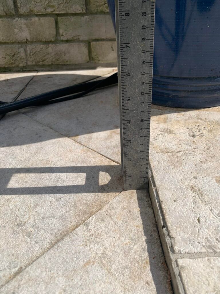 Laser level used to measure settlement in a paver surface